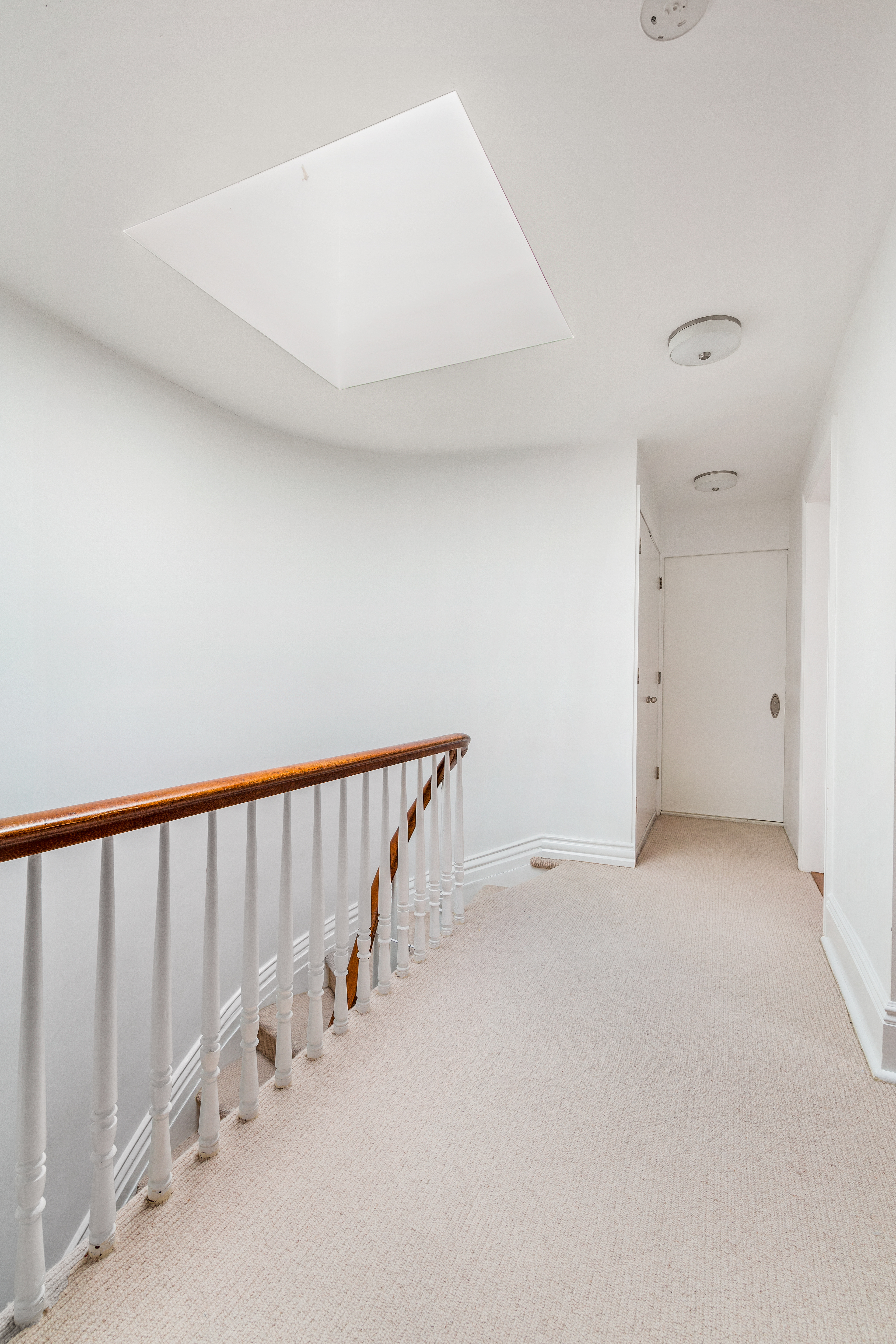176 Warren Street Brooklyn, NY 11201 - Photo 10 of 13 a view of a hallway with staircase