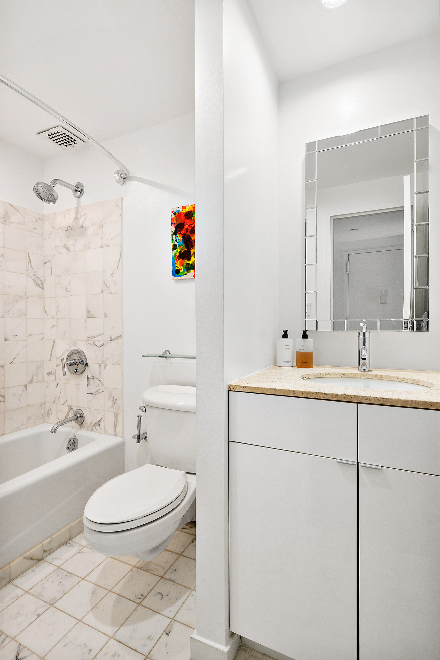 155 West 15th Street, Unit 1J Manhattan, NY 10011 - Photo 10 of 13 a bathroom with a sink a toilet and a bathtub