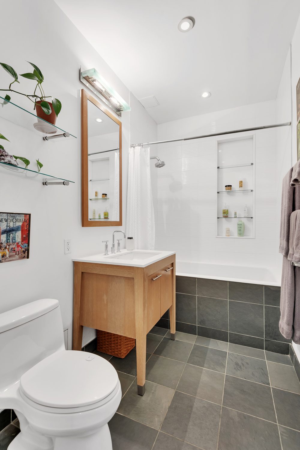 85 Adams Street, Unit 15D Brooklyn, NY 11201 - Photo 5 of 8 a bathroom with a sink a toilet and shower