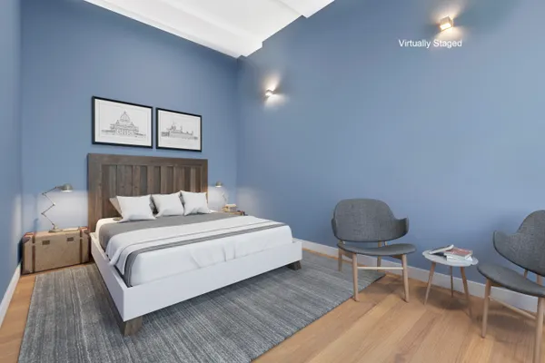 a bed room with a bed window and a chair