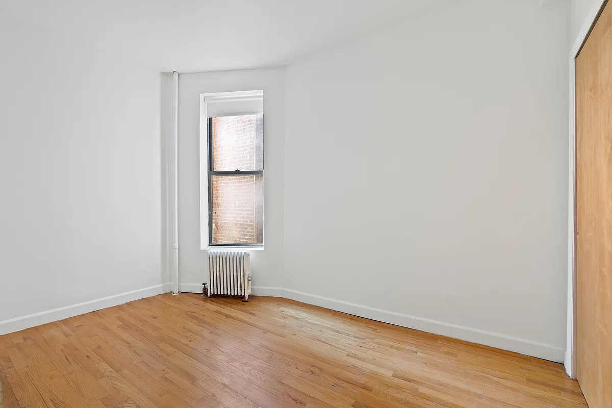 325 3rd Street, Unit 2B Brooklyn, NY 11215 - Photo 6 of 9 an empty room with wooden floor and window