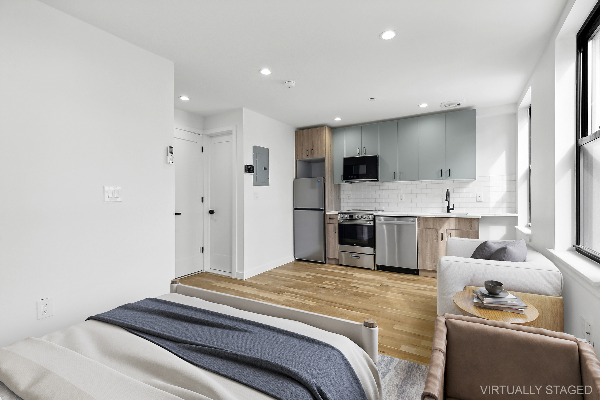 116 Madison Street Brooklyn, NY 11216 - Photo 10 of 20 a bedroom with a bed and a view of kitchen