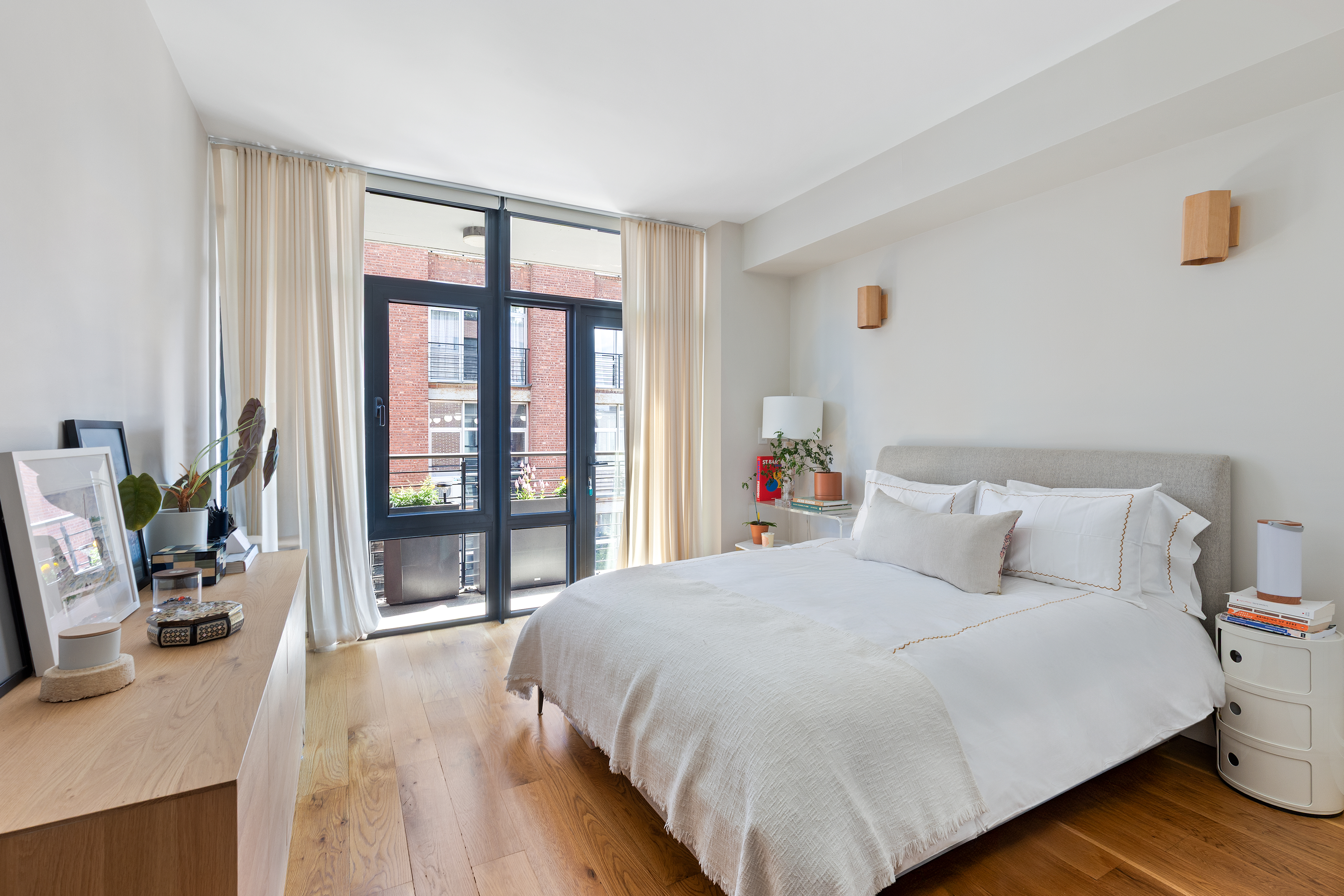 47 Bridge Street, Unit 5D Brooklyn, NY 11201 - Photo 6 of 21 a bedroom with a bed and a large window