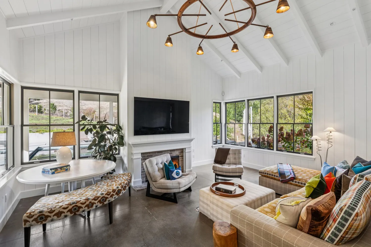 an outdoor space with furniture and garden