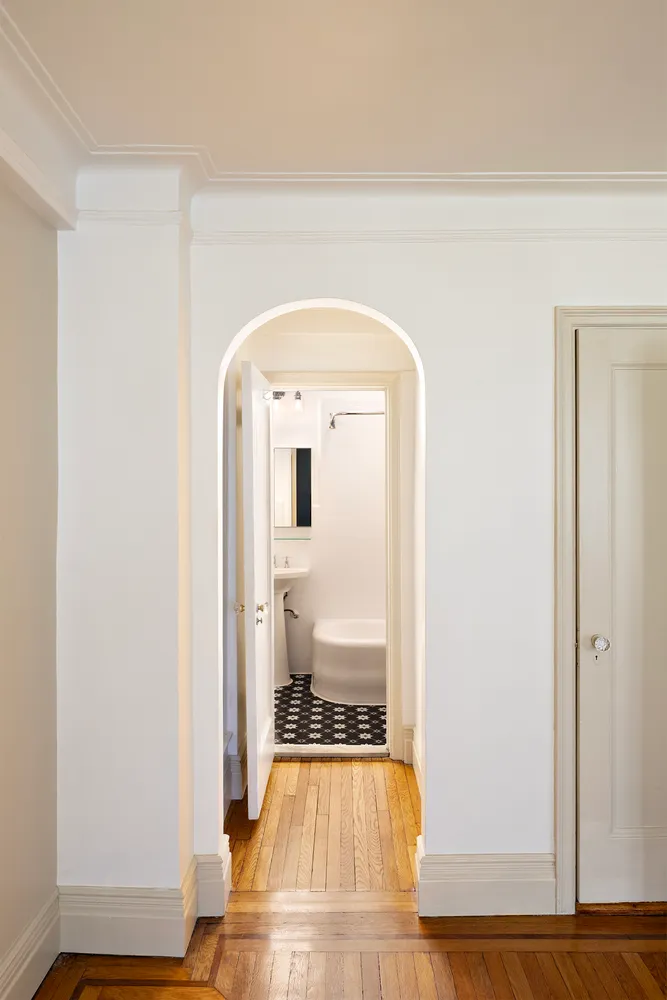 a view of a living room with wooden floor