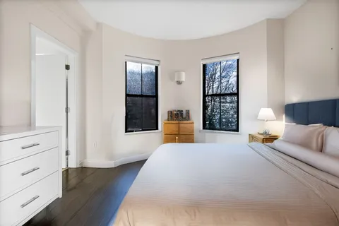 a bed room with a bed and a window