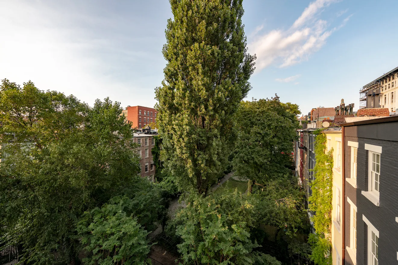 a view of a house with a yard and balcony