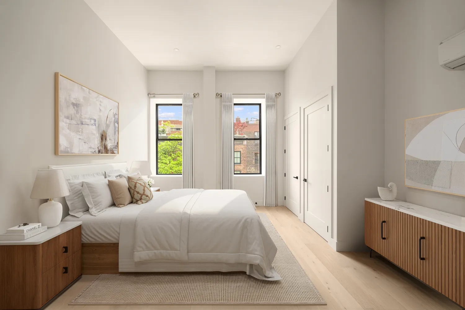 a spacious bedroom with a bed and a window