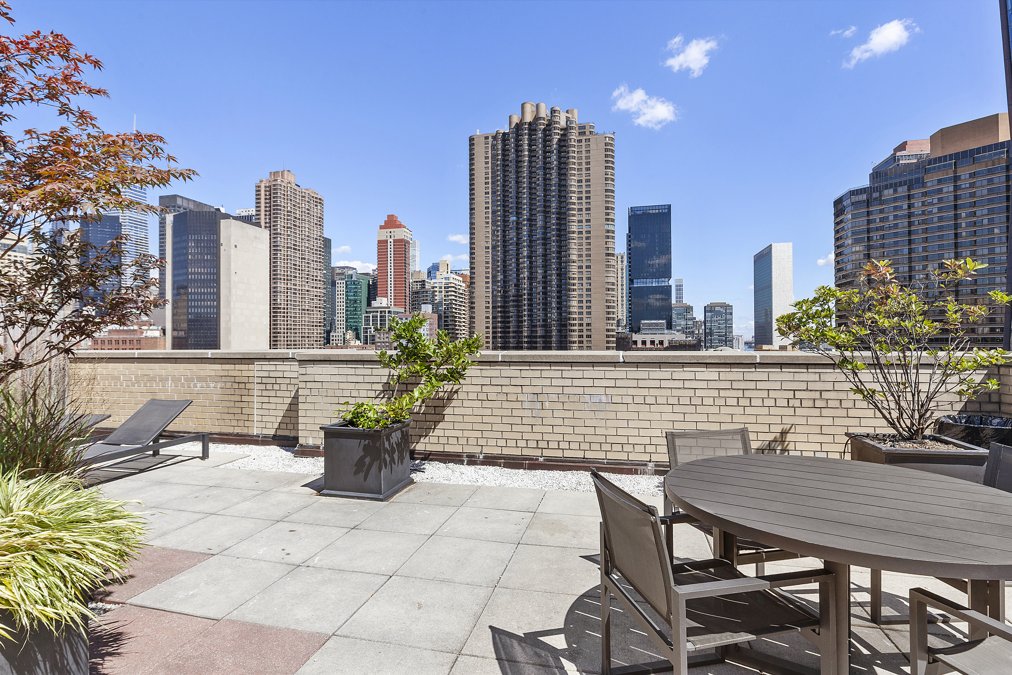 333 East 34th Street, Unit 14J Manhattan, NY 10016 - Photo 9 of 10 a view of a terrace with chairs