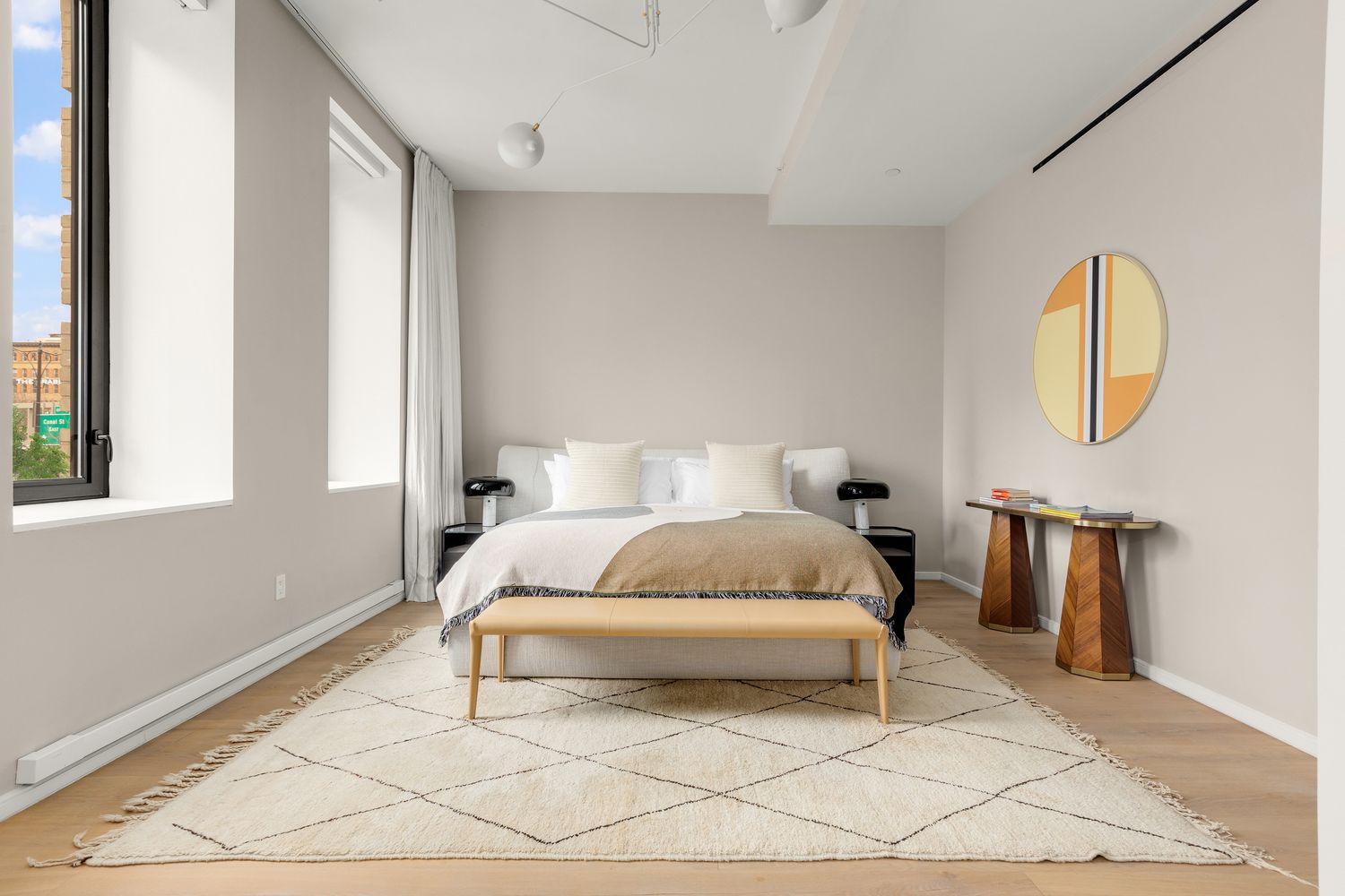 a bedroom with a bed lamp and a window