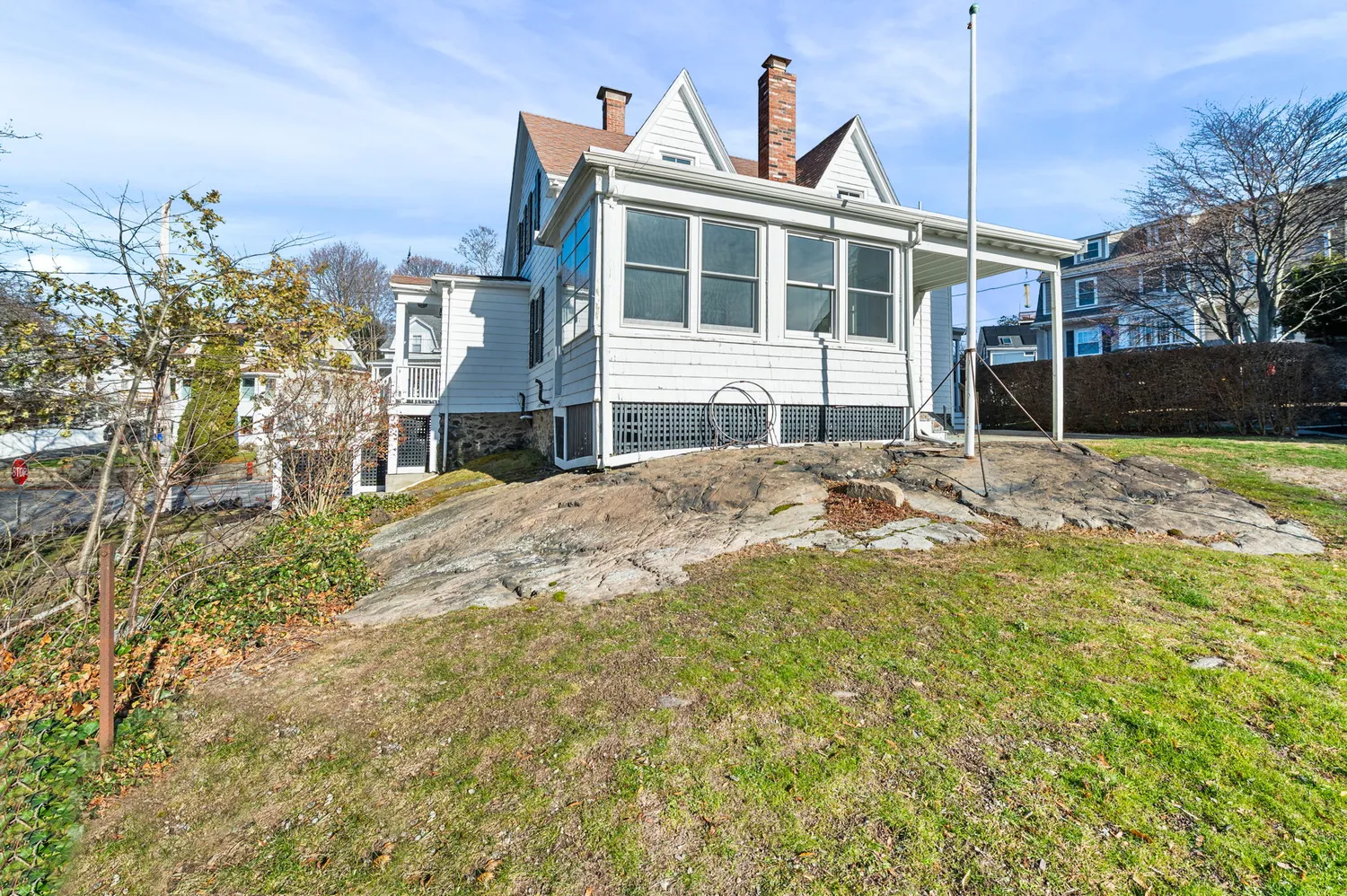 a view of a house with a yard and snow