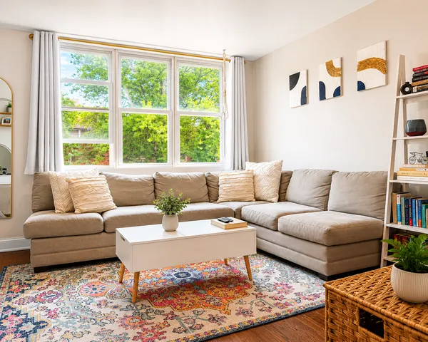 a living room with furniture and a large window
