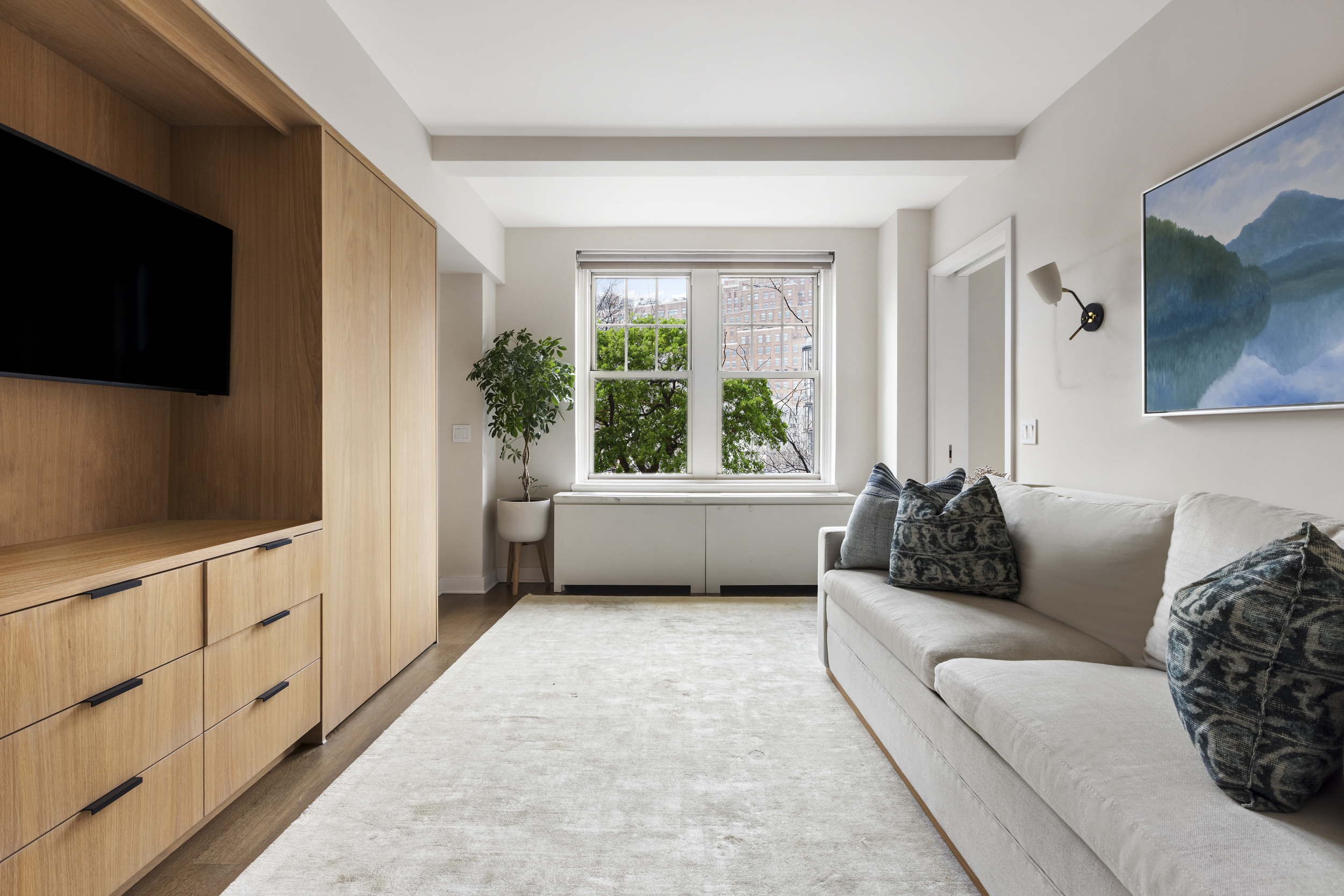 2 Horatio Street, Unit 4JS Manhattan, NY 10014 - Photo 9 of 20 a living room with furniture and a flat screen tv