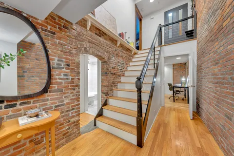 a view of entryway with wooden floor