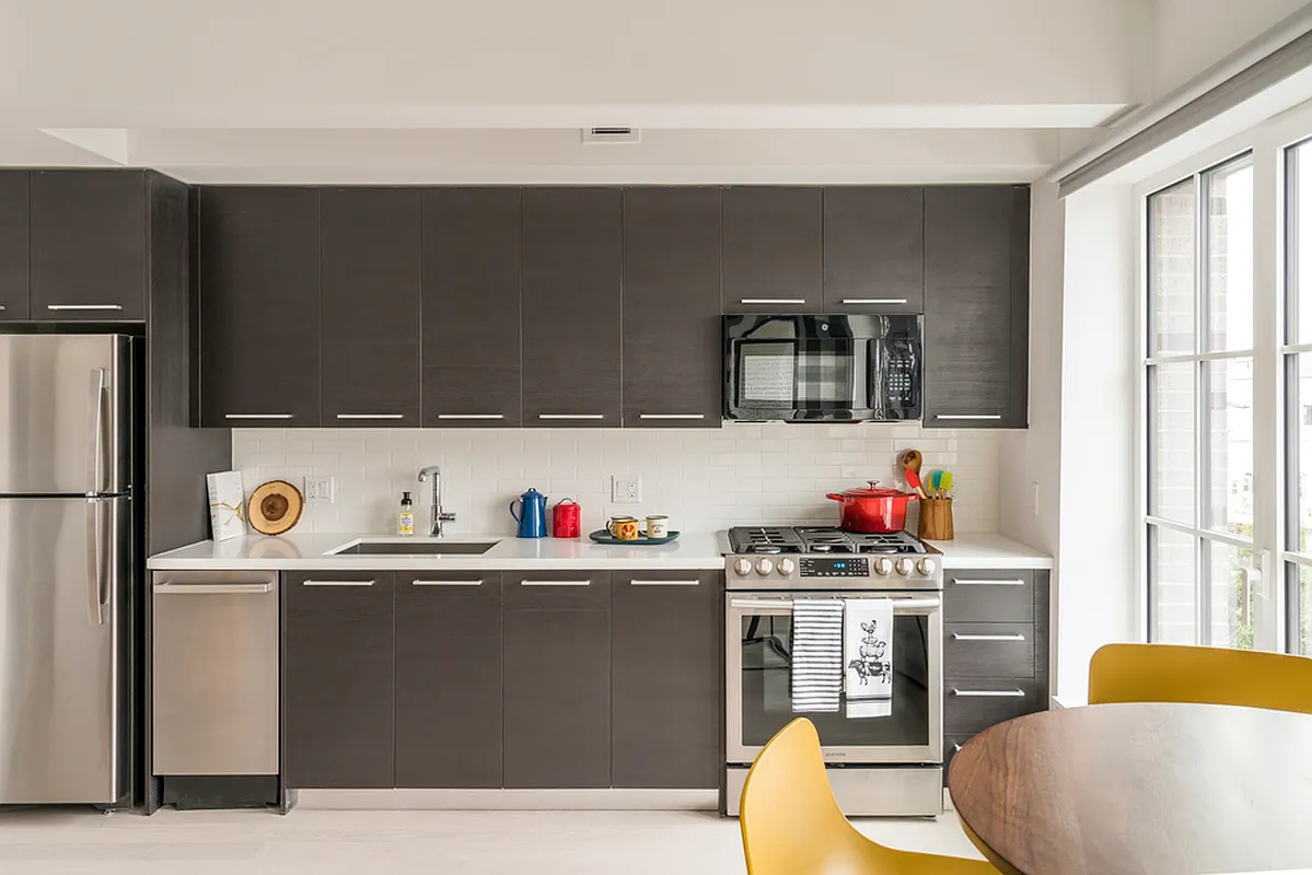 a room with cabinets a washer and dryer