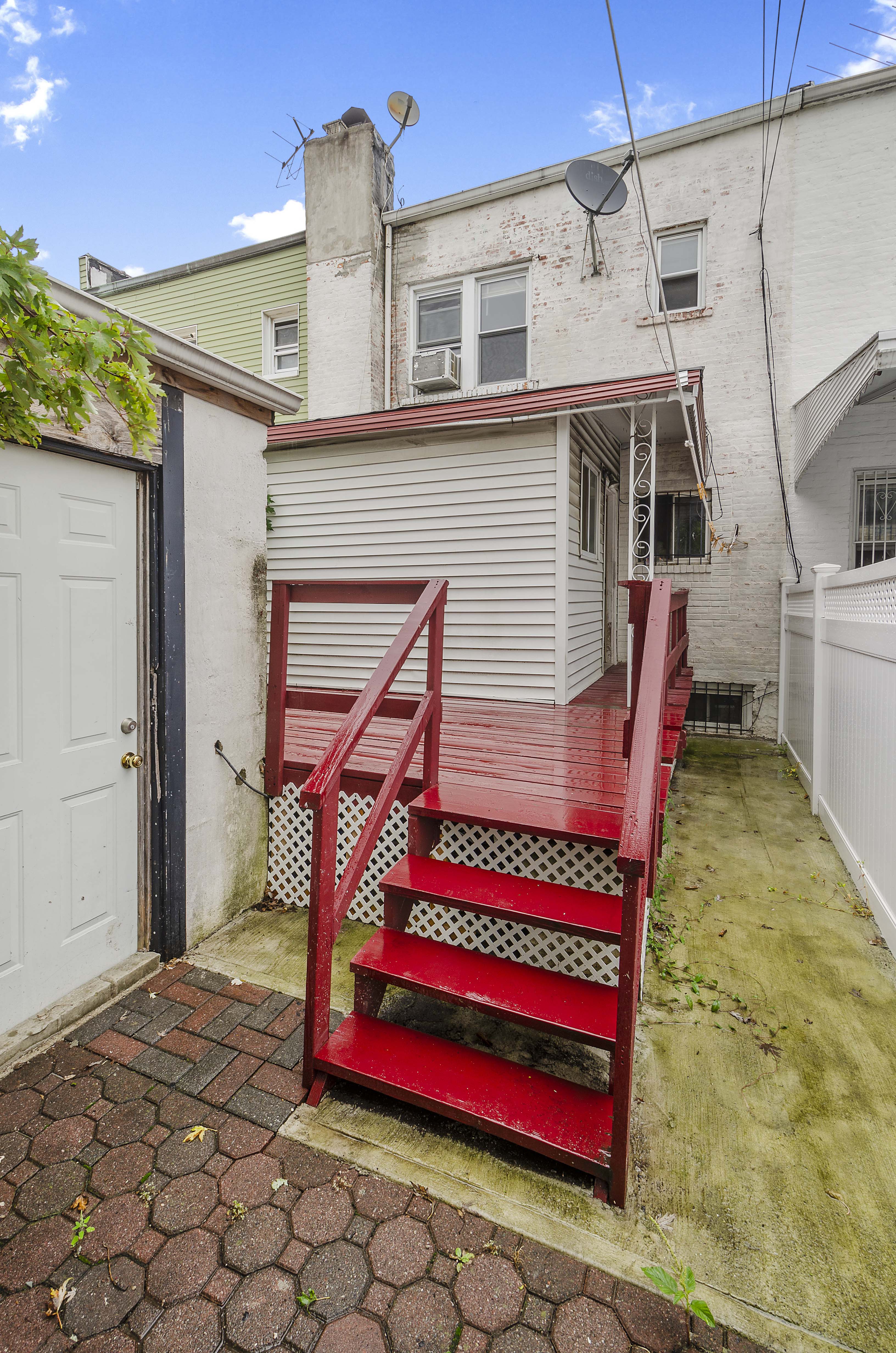1848 East 49th Street Brooklyn, NY 11234 - Photo 5 of 7 a front view of a house with a yard