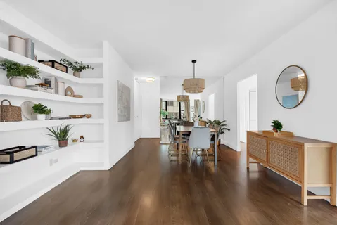 a view of dining room and hall with wooden floor