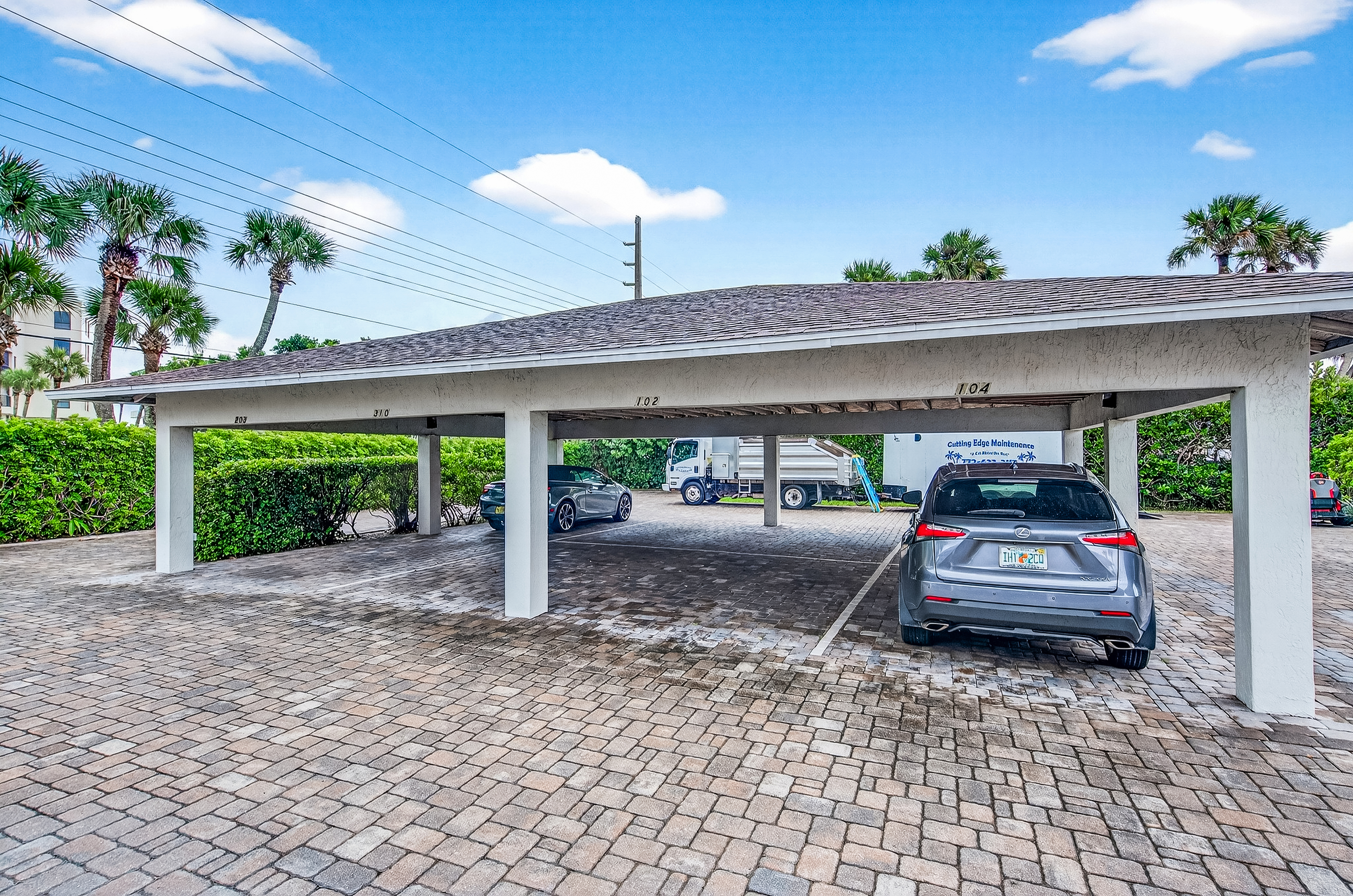4601 Highway A1a, Unit 102 Vero Beach, FL 32963 - Photo 26 of 29 a car parked in front of a building
