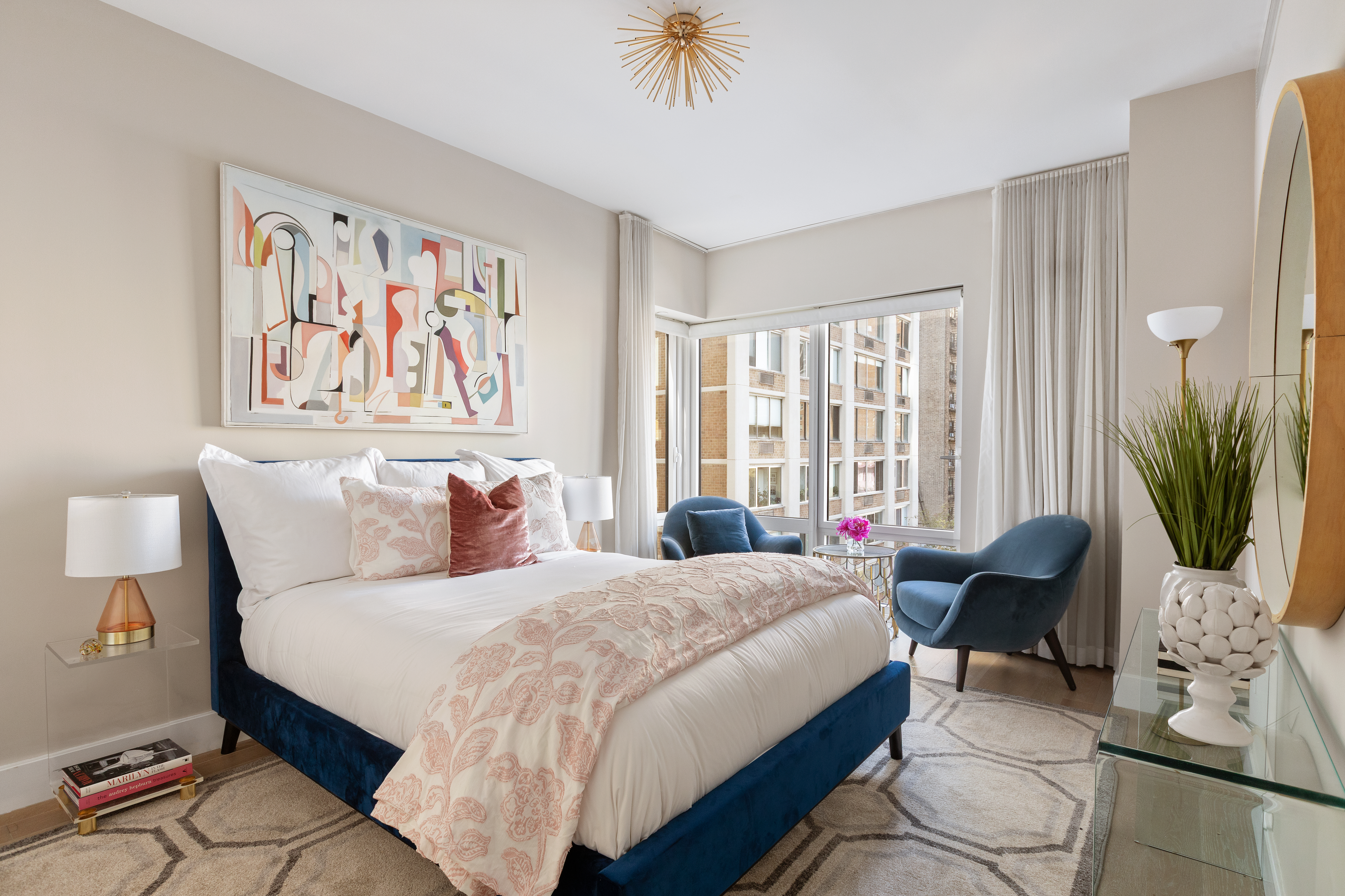 1355 1st Avenue, Unit 8 Manhattan, NY 10021 - Photo 18 of 25 a spacious bedroom with a bed a couch and a potted plant