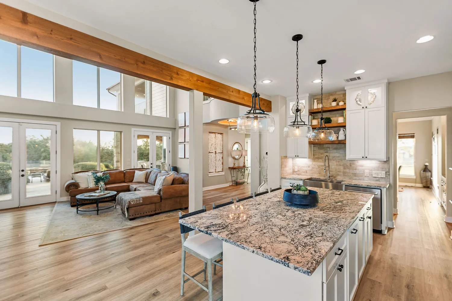 a bedroom with a bed a couch and a flat screen tv
