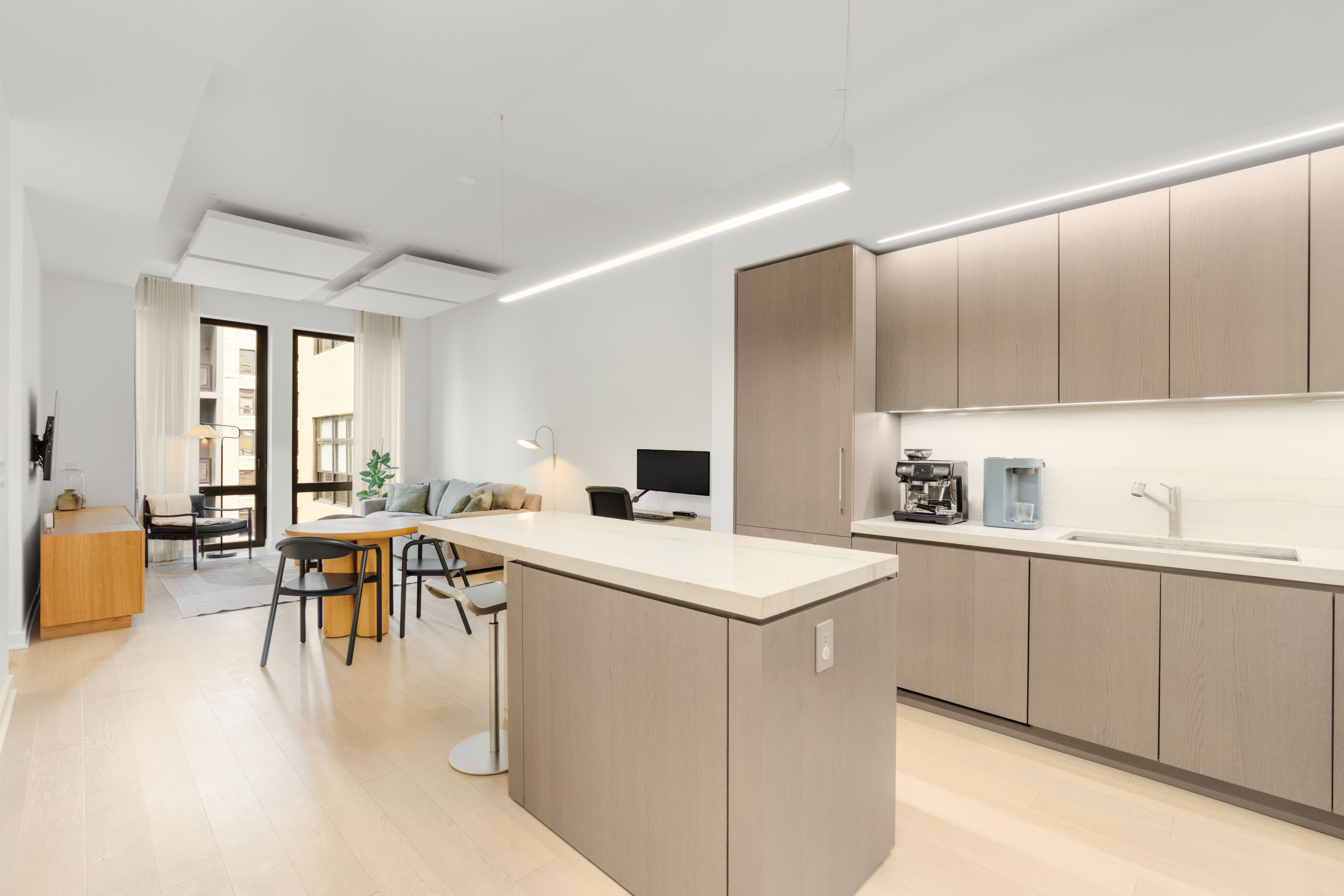 77 Charlton Street, Unit S10A Manhattan, NY 10014 - Photo 1 of 27 a kitchen with a sink a table and chairs