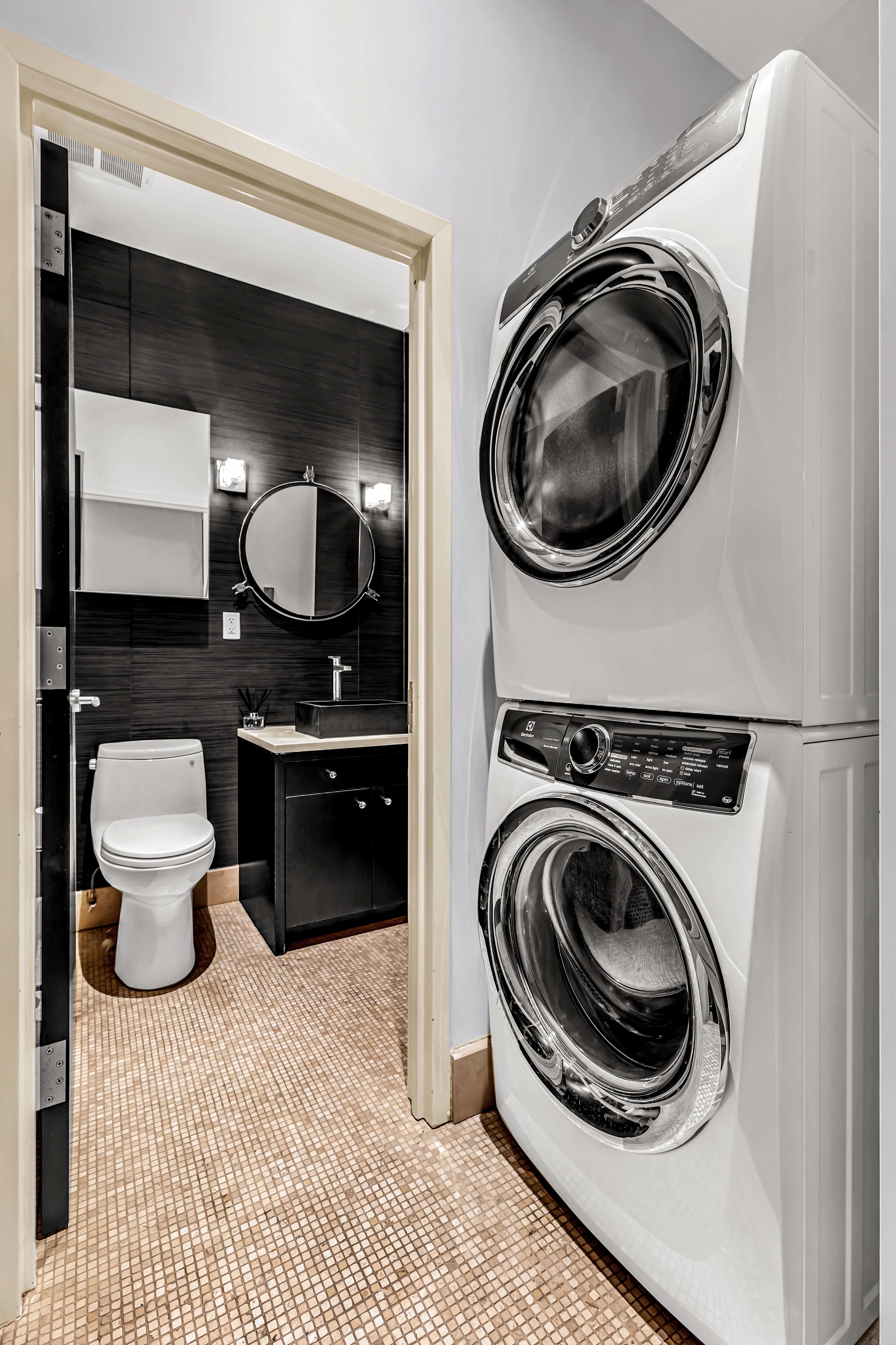 175 Franklin Street, Unit 4 Manhattan, NY 10013 - Photo 8 of 13 a view of a bedroom with washer and dryer