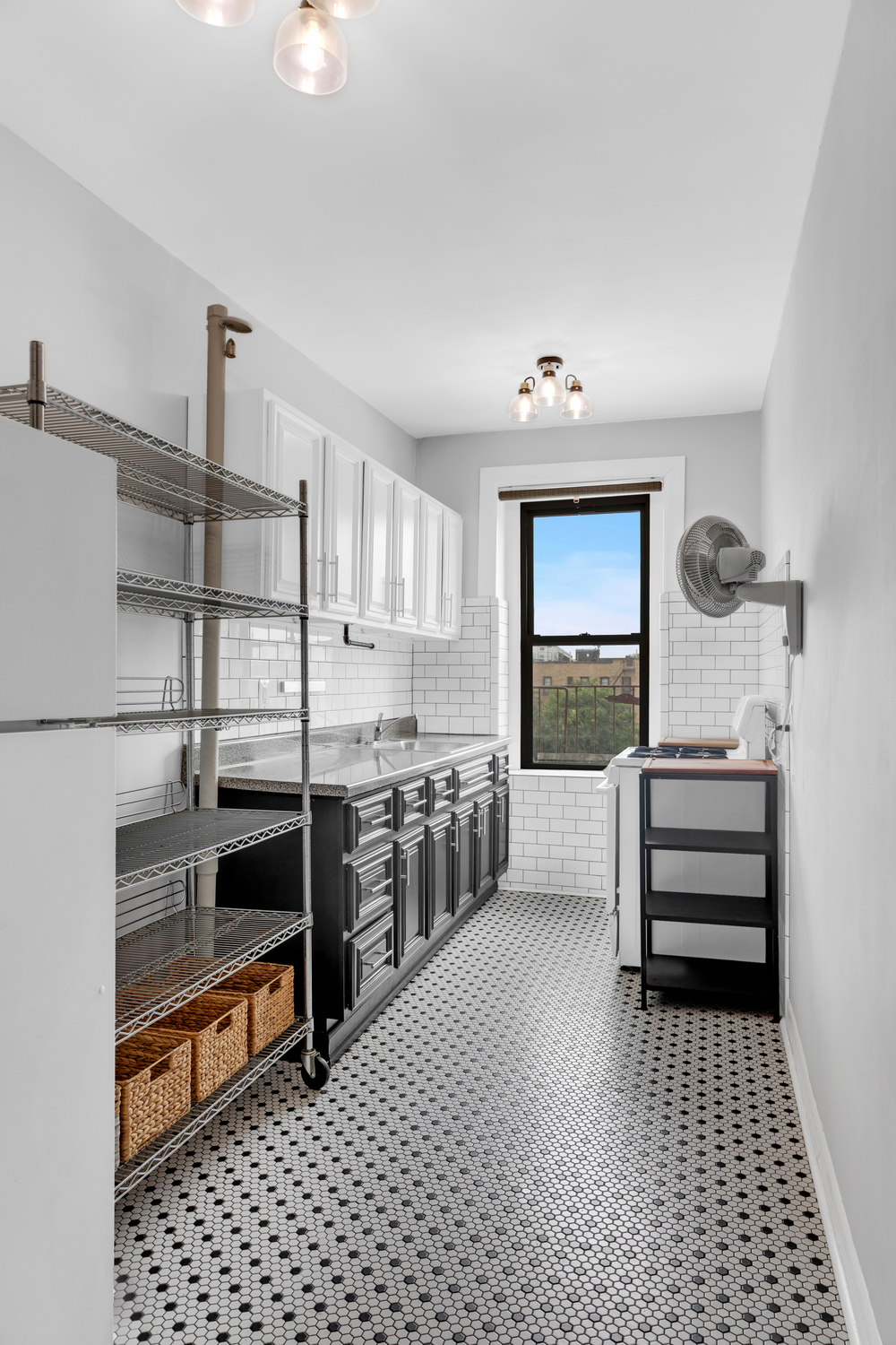 37-20 83rd Street, Unit 6J Queens, NY 11372 - Photo 6 of 14 a kitchen with stainless steel appliances kitchen island granite countertop a refrigerator and a stove top oven