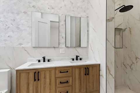 a bathroom with a sink and a mirror