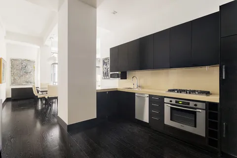 a bathroom with a sink toilet and vanity