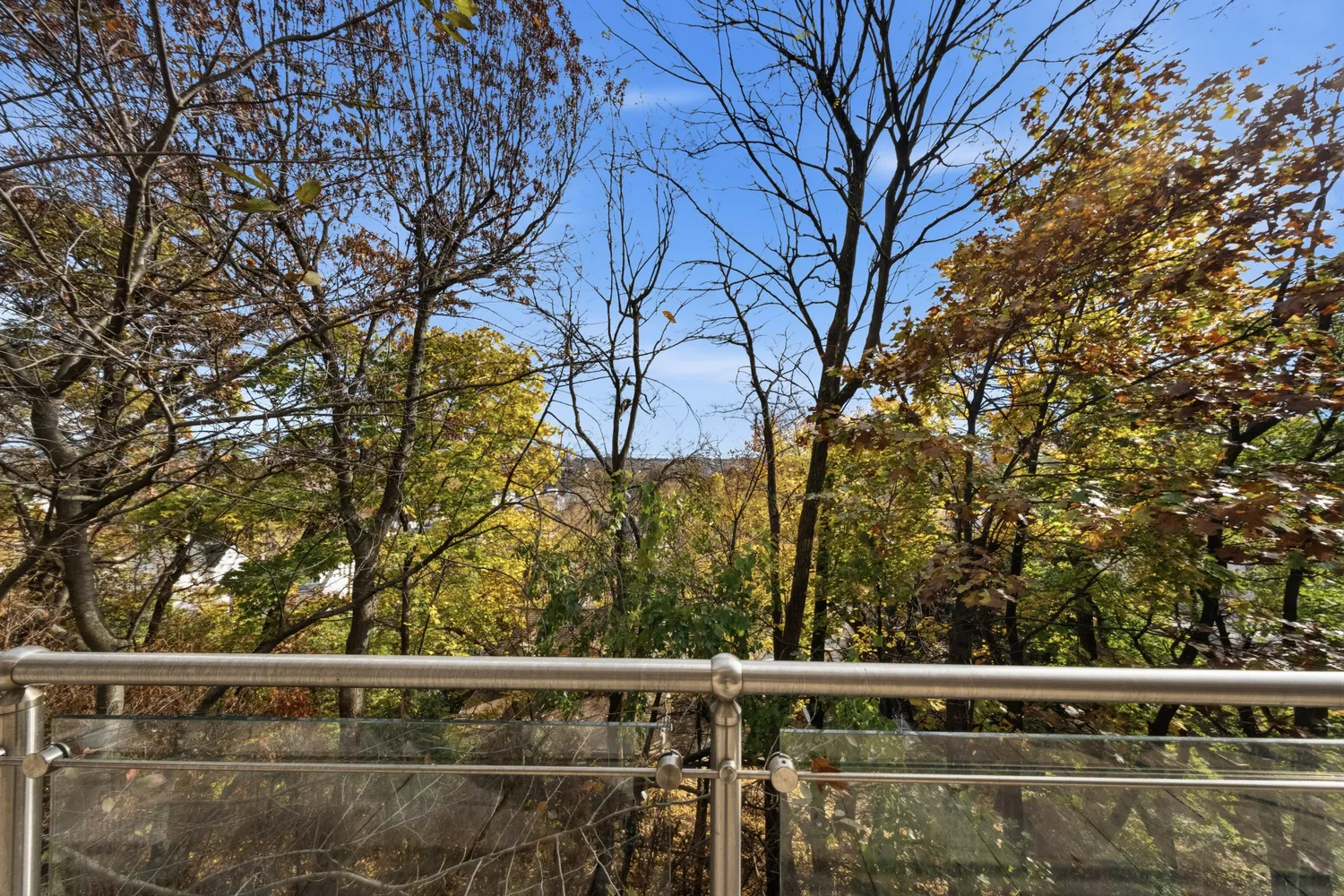 a bathroom with a toilet a sink a mirror a shower and vanity