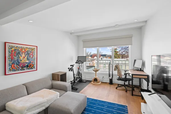 a view of a livingroom with workspace and a couch