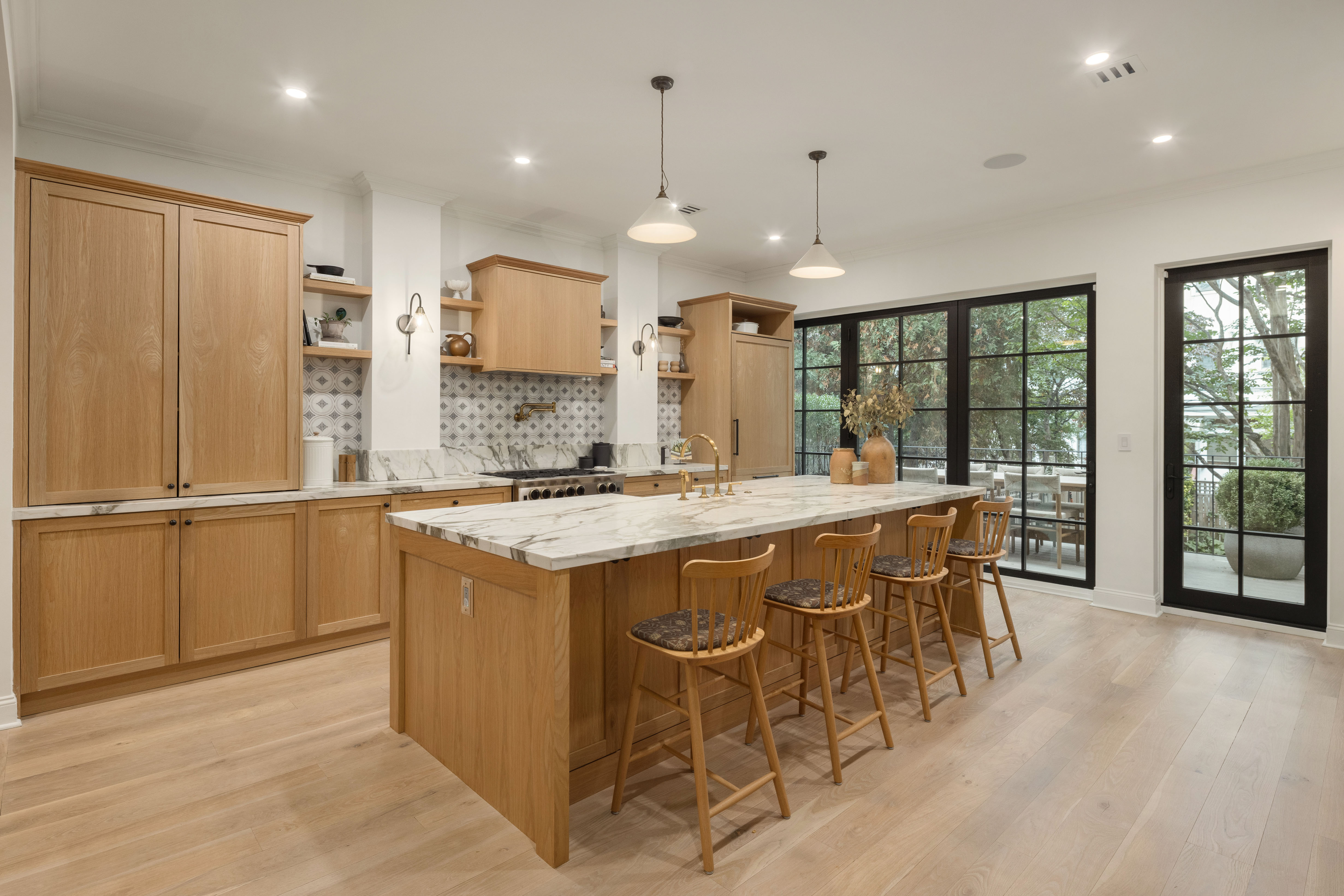 309 Pacific Street Brooklyn, NY 11201 - Photo 2 of 22 a kitchen with kitchen island granite countertop wooden cabinets and a refrigerator