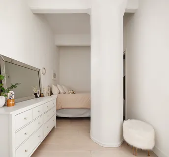 a bathroom with a double vanity sink and mirror