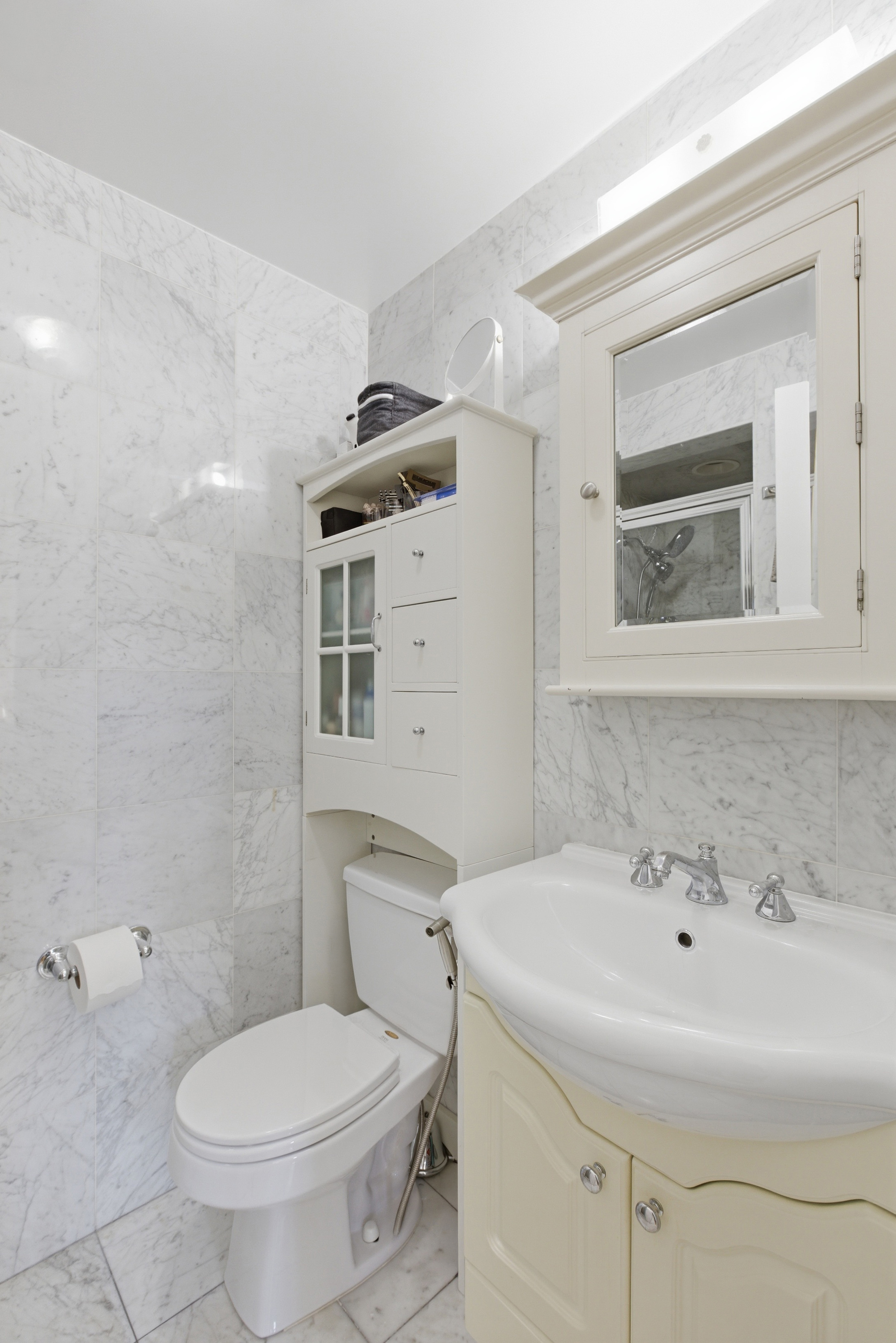 392 11th Street, Unit 3A Brooklyn, NY 11215 - Photo 9 of 11 a bathroom with a sink a toilet and shower