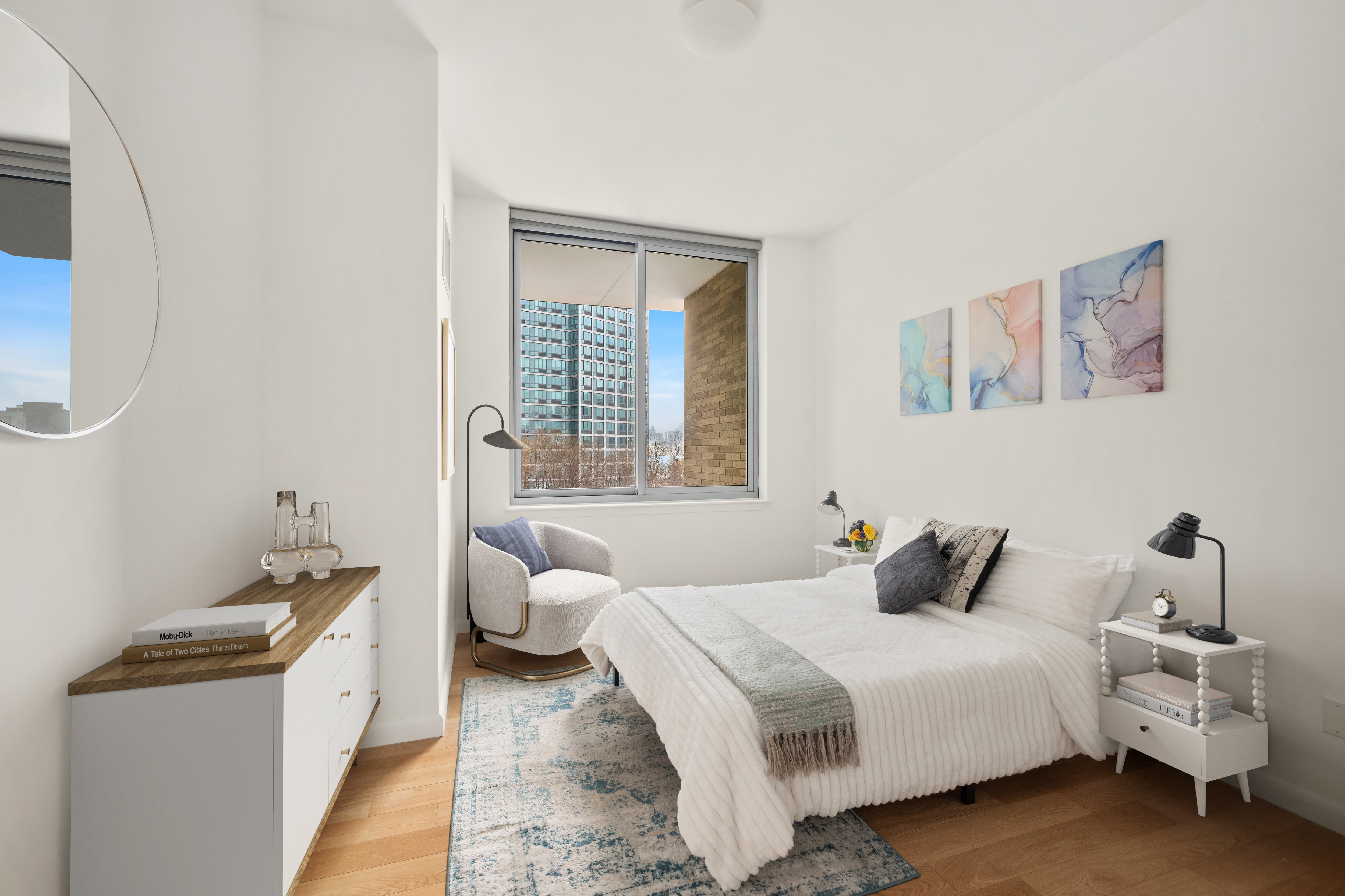 46-30 Center Boulevard, Unit 406 Queens, NY 11109 - Photo 6 of 23 a bedroom with a bed and a window