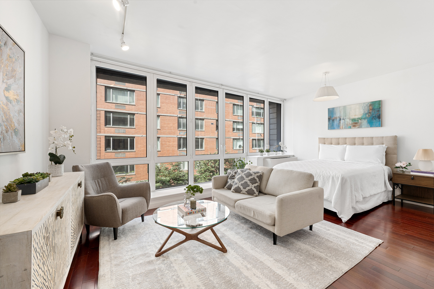 125 West 21st Street, Unit 4C Manhattan, NY 10011 - Photo 1 of 12 a living room with furniture rug and window