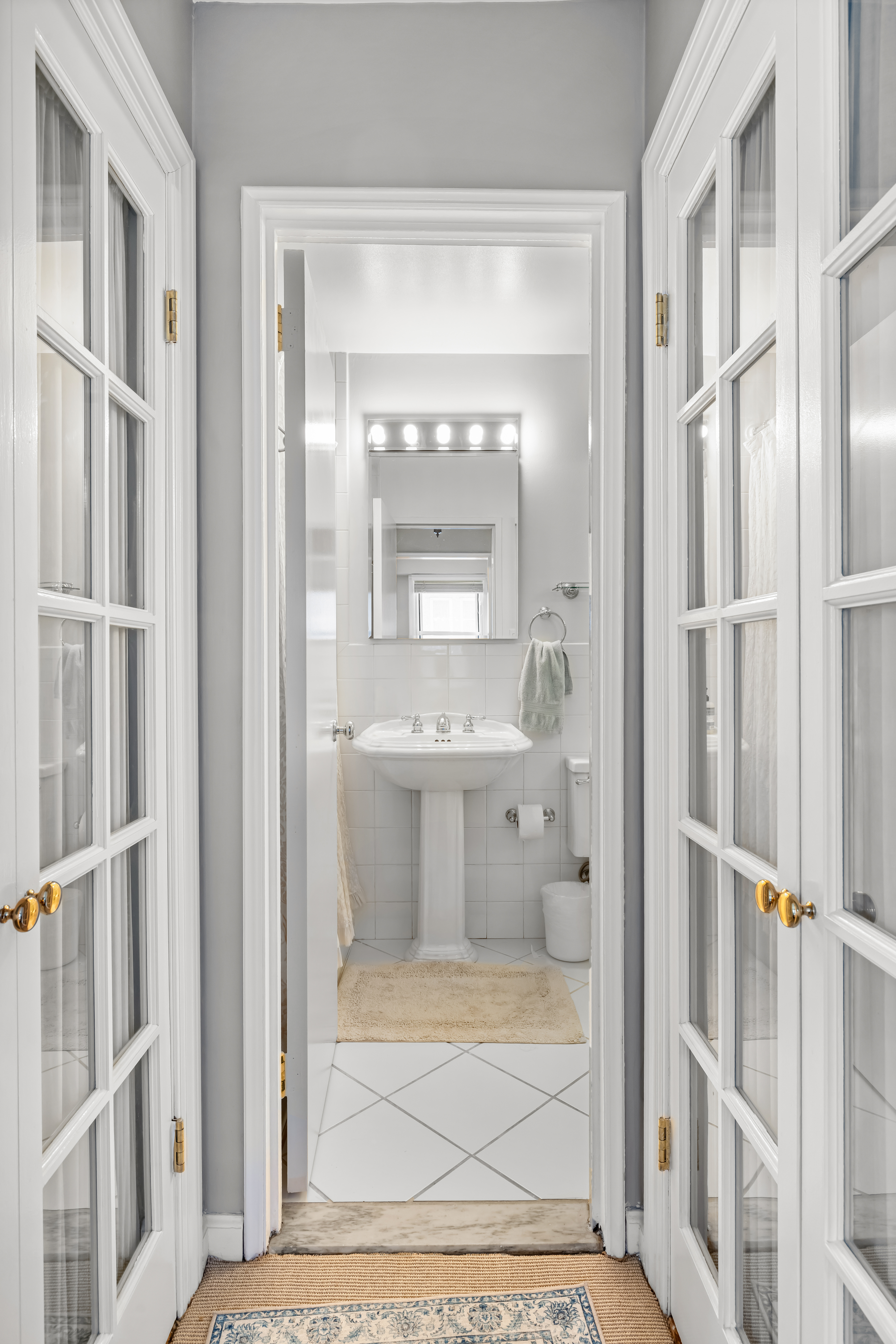 123 East 75th Street, Unit 5C Manhattan, NY 10021 - Photo 5 of 8 a bathroom with a shower and a sink