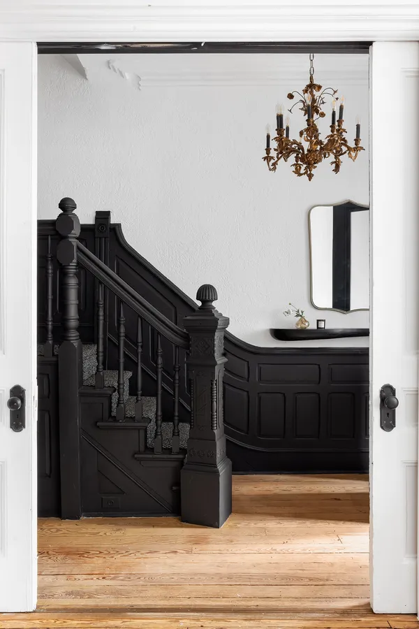 a bedroom with a bed and a fireplace