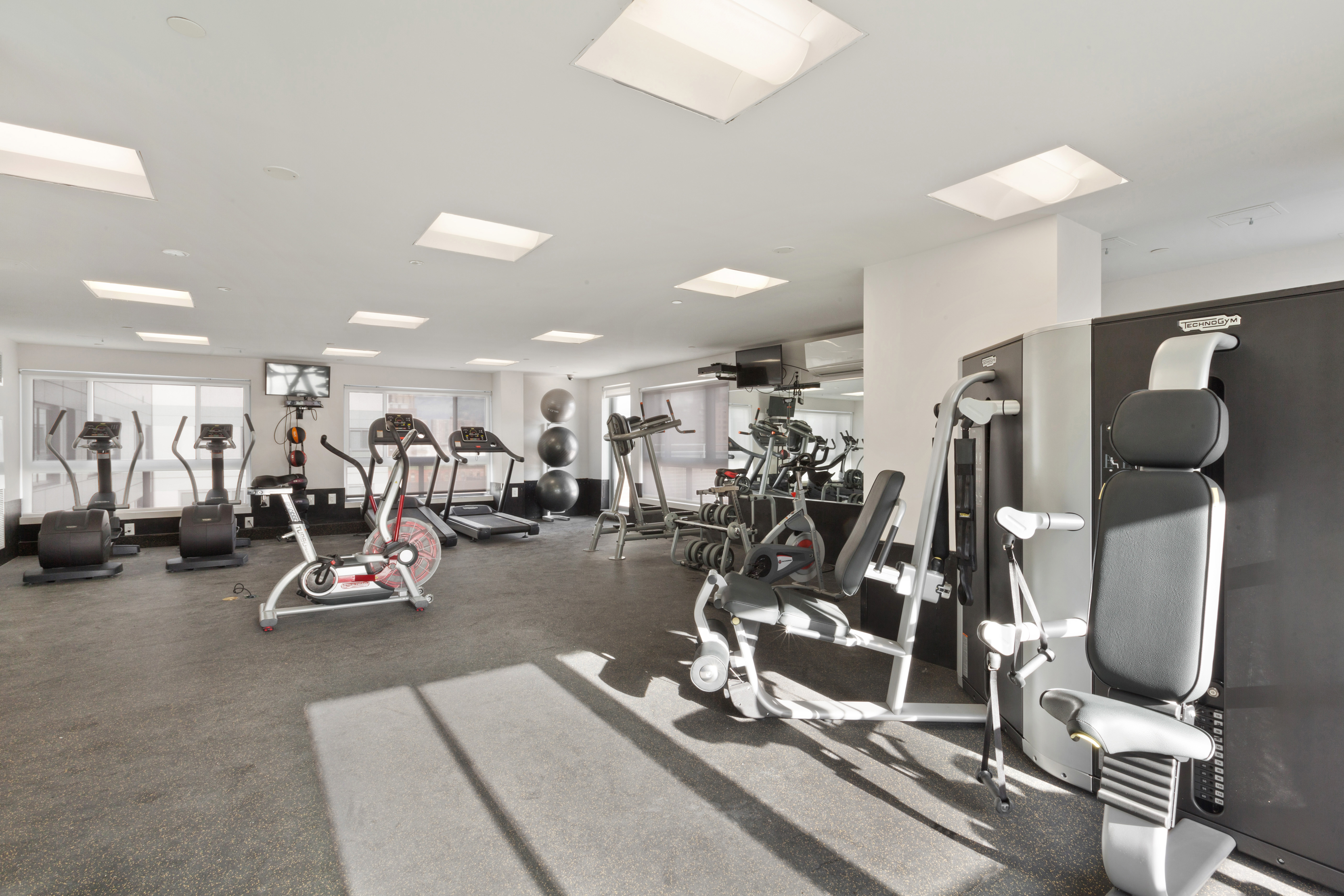 171 West 131st Street, Unit 517 Manhattan, NY 10027 - Photo 7 of 10 a view of a room with gym equipment