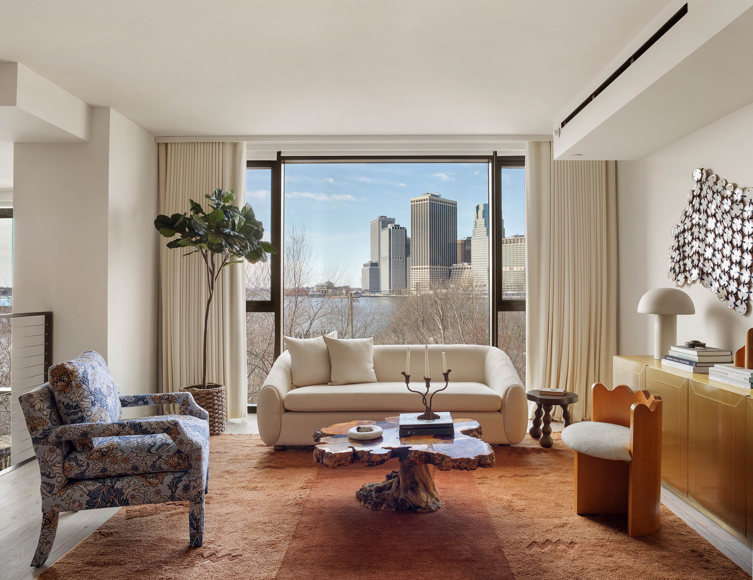 90 Furman Street, Unit N411 Brooklyn, NY 11201 - Photo 6 of 29 a living room with furniture and a potted plant