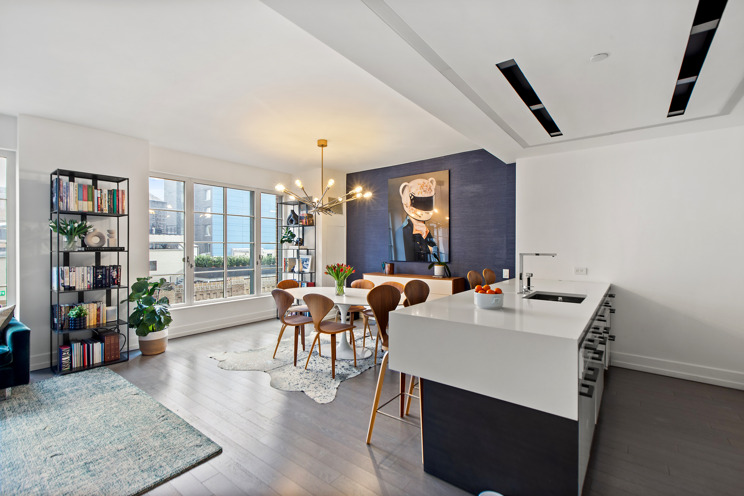 70 Charlton Street, Unit 16C Manhattan, NY 10014 - Photo 2 of 31 a view of a dining room with furniture and a potted plant