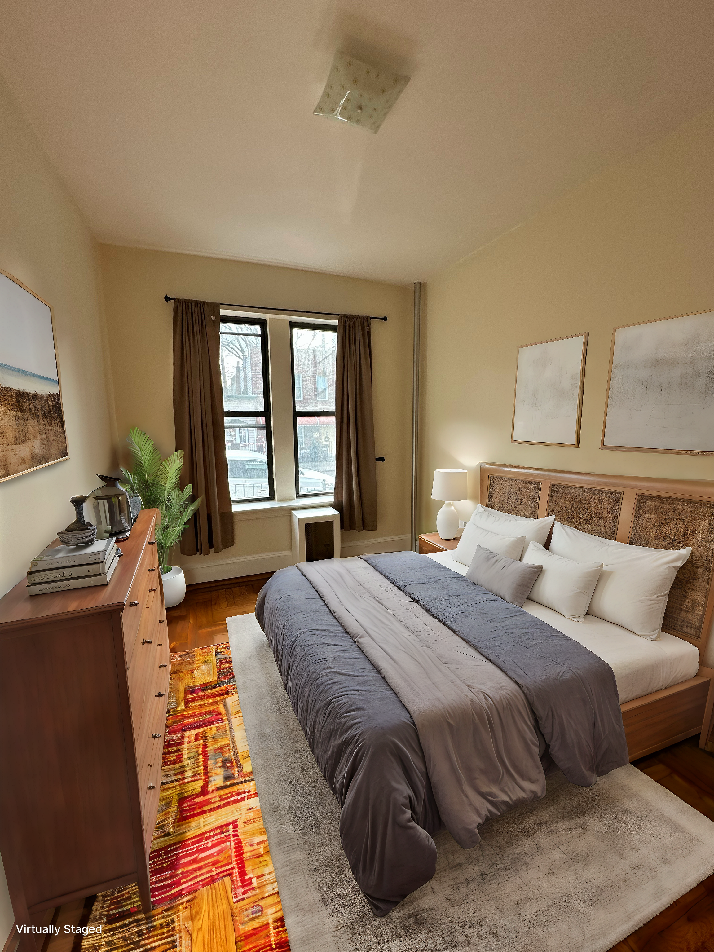 31-40 42nd Street, Unit 1F Queens, NY 11103 - Photo 4 of 9 a bedroom with bed and a couch