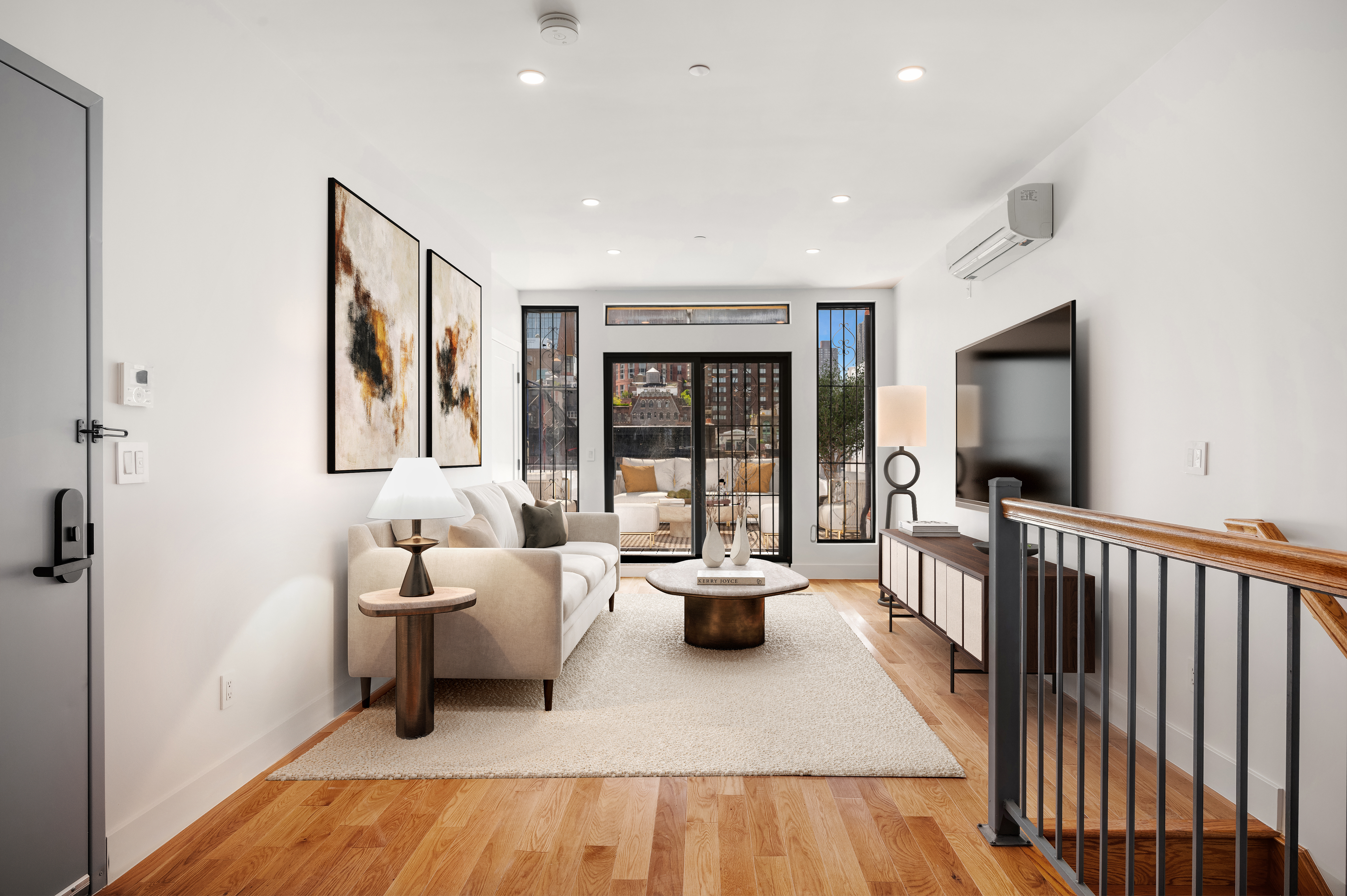 61 West 70th Street, Unit PH Manhattan, NY 10023 - Photo 3 of 18 a living room with furniture and a flat screen tv