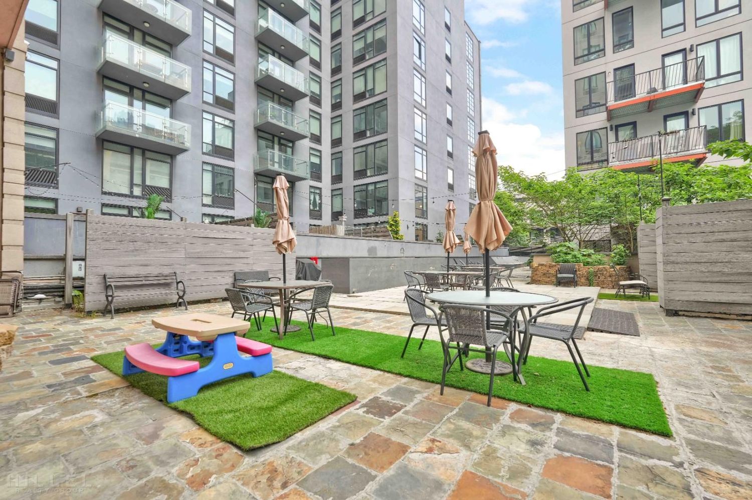 189 Bridge Street, Unit 3A Brooklyn, NY 11201 - Photo 18 of 19 a view of a brick building with a yard