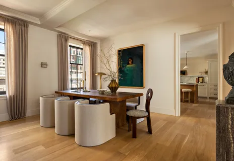 a view of a dining room with furniture and window