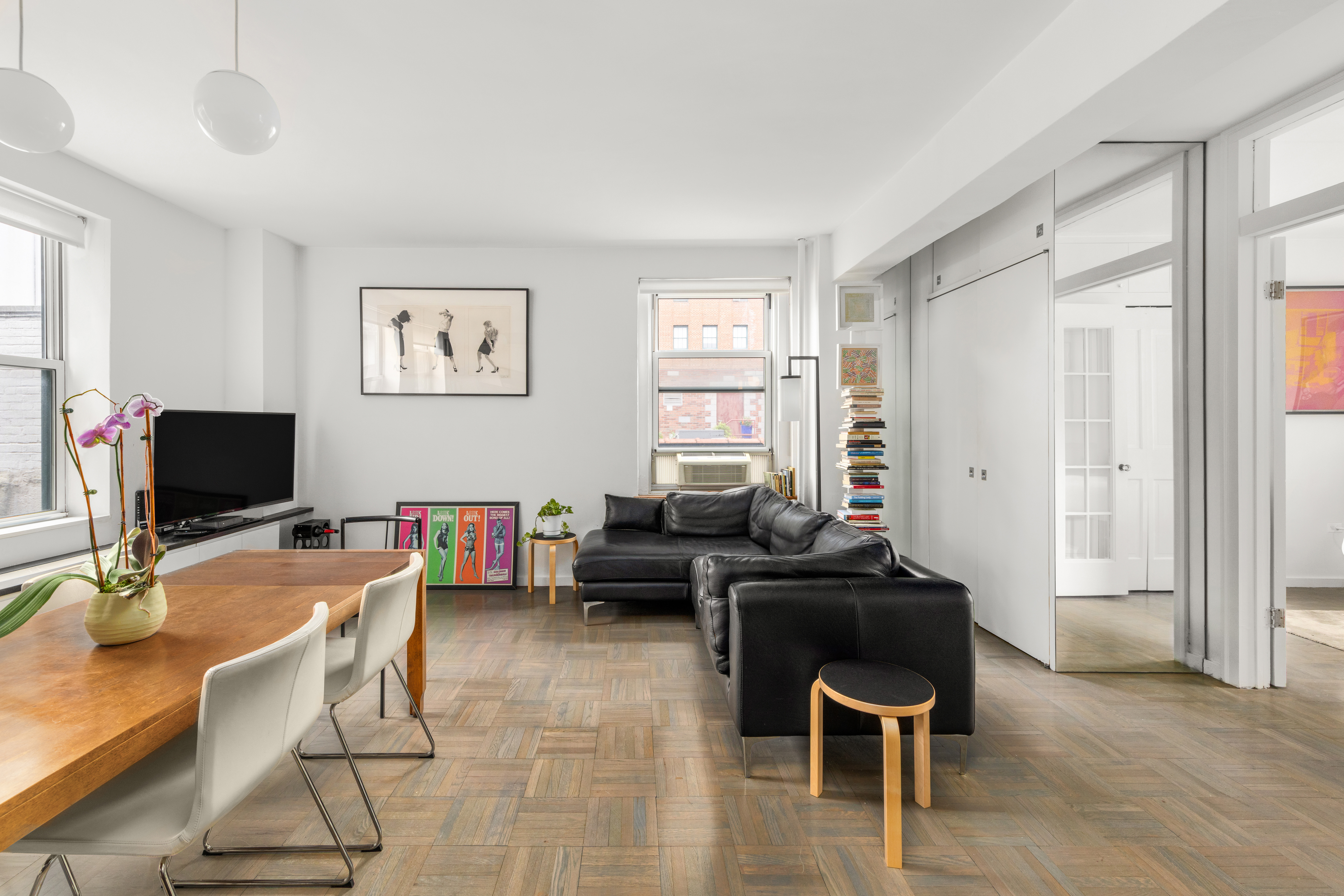 131 Avenue B, Unit 4A Manhattan, NY 10009 - Photo 2 of 11 a livingroom with workspace and a window