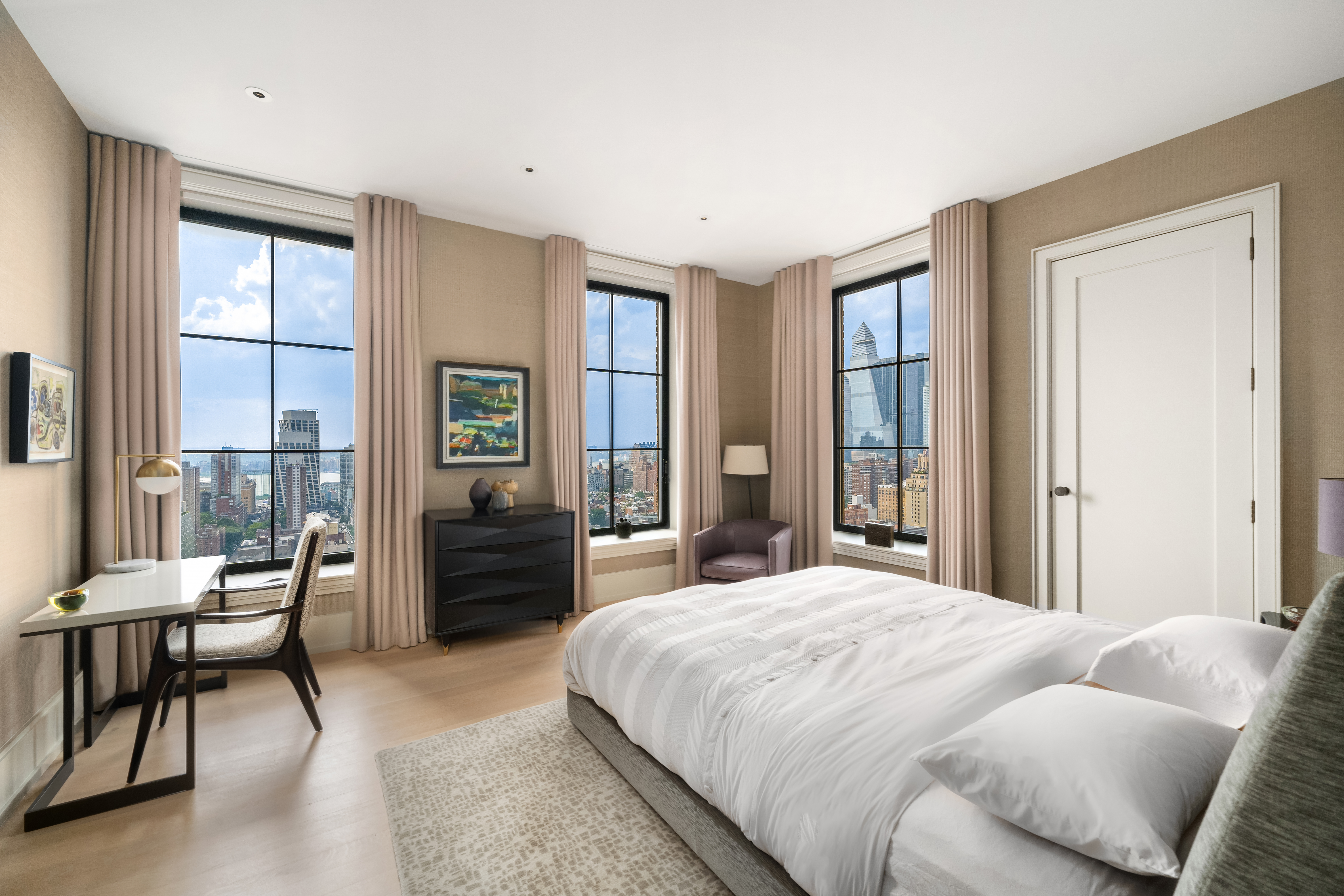 212 West 18th Street, Unit 19C Manhattan, NY 10011 - Photo 13 of 27 a bedroom with a bed and a couch