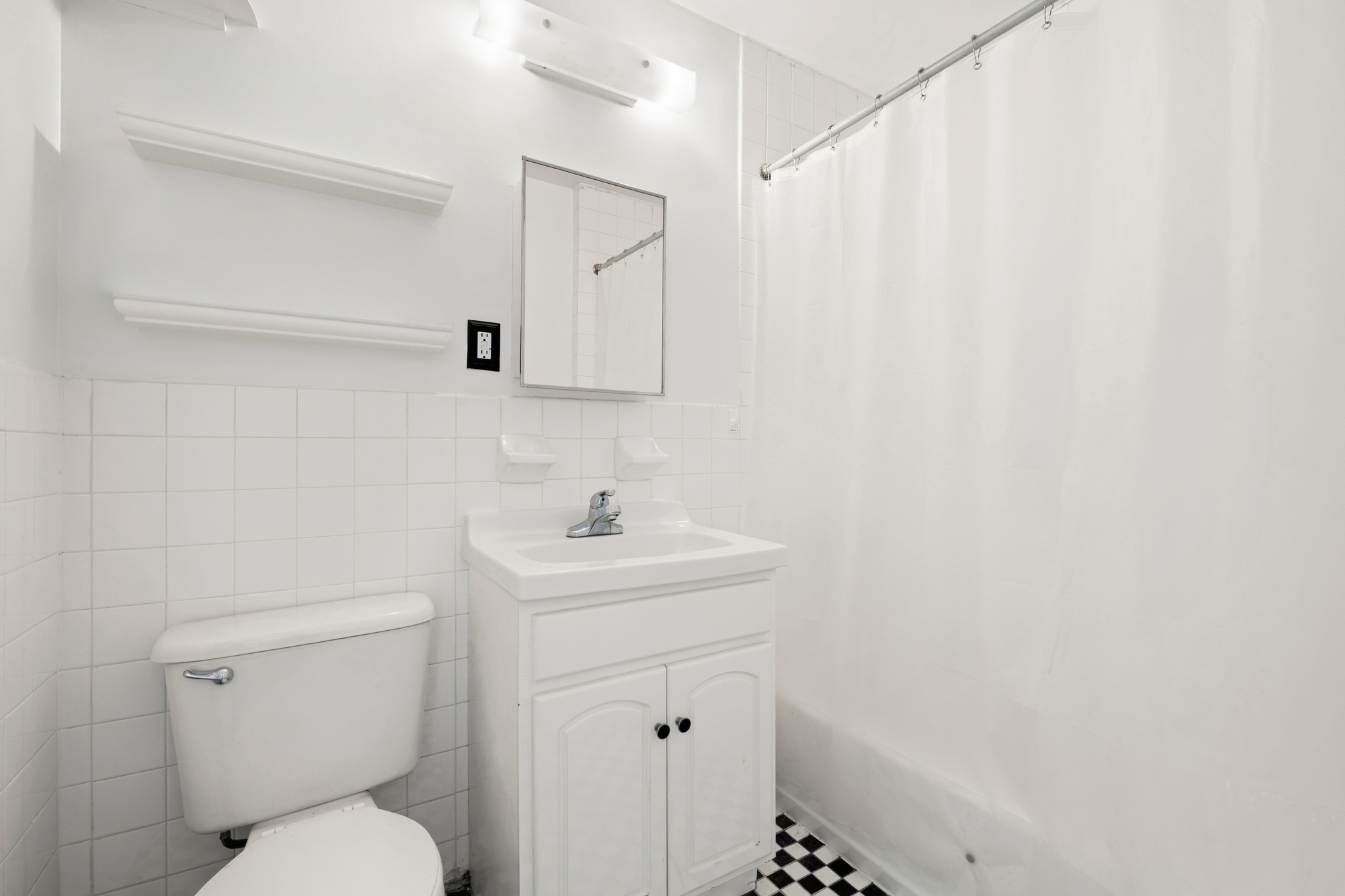 522 West 149th Street, Unit 3 Manhattan, NY 10031 - Photo 5 of 7 a bathroom with a sink a toilet and a mirror