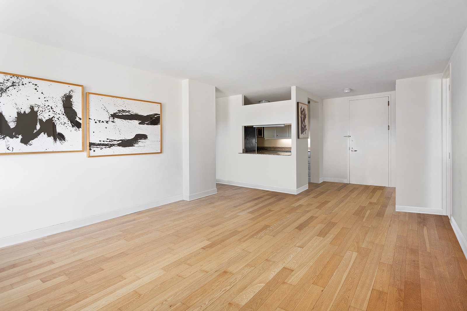 1965 Broadway, Unit 11D Manhattan, NY 10023 - Photo 4 of 13 a view of a room with wooden floor and cabinets