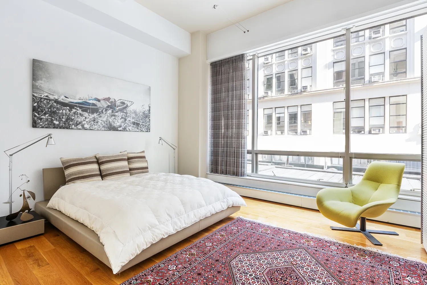 a bedroom with a bed and a couch